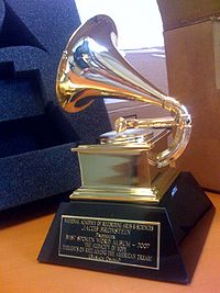 The picture of a Grammy Award, a thropy that features a golden gramophone on a black marbel block. The award belongs to Jacob Bronstein, who won it in 2007 for Best Spoken Word Album.
