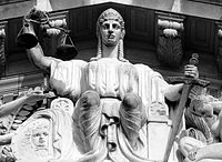 A statue of Justice on the tympanum of the Old Supreme Court Building, Singapore