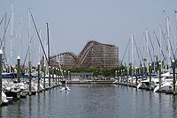 The boardwalk rollercoaster appears in the background with the lake and the marina in the foreground