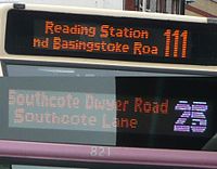 LED destination displays on buses, one with a colored route number.