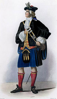 A man in elaborate eighteenth century highland dress wearing a black jacket, purple kilt-like garment and armed with a basket-hilted sword