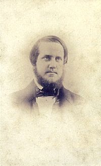 A head and shoulders daguerreotype portrait of a young man with short beard wearing a dark suit and cravat