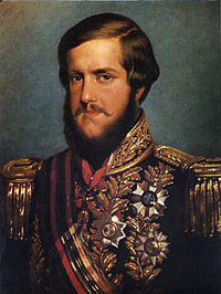 Painted portrait of a young man with auburn hair and a full beard who wears a heavily embroidered military-type tunic bedecked with medals and a sash of office across the chest