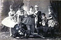 A group of ballet dancers dressed in 17th-century costumes.