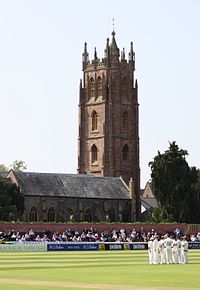 Church of St. James, Taunton, with a cricket ground in the foreground.