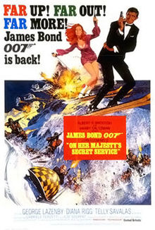 A man in a dinner jacket on skis, holding a gun.  Next to him is a red-headed woman, also on skis and with a gun.  They are being pursued by men on skis and a bobsleigh, all with guns. In the top left of the picture are the words FAR UP! FAR OUT! FAR MORE! James Bond 007 is back!
