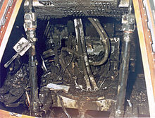 An inside of some device, charred and apparently destroyed.