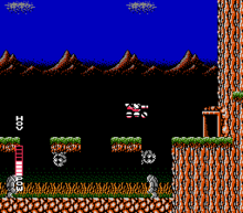 A pink vehicle (which is SOPHIA THE 3RD) is in the center of the screen, jumping from a floating platform to a door on the right side of the screen. Below the floating platform are grey wall-walking enemies, a grey statuesque walking enemy, and a swamp-like bottom. The background consists of mountains in a dark blue sky.