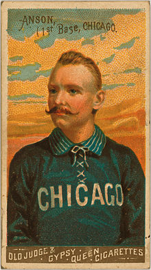 Baseball card depicting a half-length portrait of a mustachioed man in a blue baseball uniform