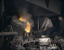 Casting a billet from an electric furnace, Chase Brass and Copper Co., Euclid, Ohio.