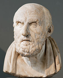 Stone bust of a bearded, grave-looking man