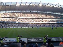 Manchester City fans watch Manchester City play Birmingham City at Eastlands