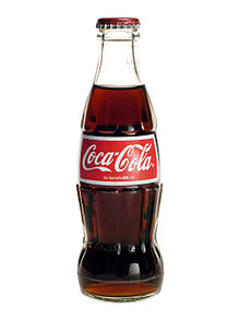 A characteristically shaped Coca-Cola bottle.