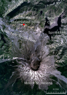 Satellite image of the area surrounding Mount St. Helens, labeled with various locations. The primary locations marked are: Mount St. Helens (in the center of the volcano there is a circular black crater); and to the north of the volcano the Coldwater II observation post, where Johnston was camped. The other locations marked are three lakes (Spirit Lake, Bear Cove, and Coldwater lake) and a river (North Fork Toutle River).