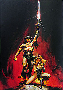 A man, wearing nothing but a loincloth and a horned helm, strides forth, holding a sword aloft in his left hand.  A blond woman kneels in front of him, holding a curved blade with both hands.