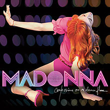 Back of a woman with fiery red hair and wearing a pink leotard. Her legs are stretched apart and she wears pink colored shoes with heels. Her left hand is stretched right out and she tilts her head back while supporting herself with her right hand. The backdrop reveals small colored circles like a disco ball. On the image, the word "Madonna" is written in capital pink-and-white stripes. Beneath it, the words "Confessions on a Dance Floor" is written in white flowing script.