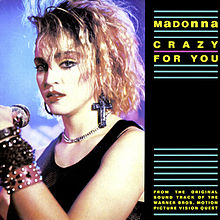 Three-fourth of the image consists of the picture of the left profile of a young blond woman. She has unkempt hair and wears a number of bangles on her left hand. A crucifix hangs from her left ear and a thin chain is visible on her neck. The other one-fourth of the image is black and on it the words "Madonna" and "Crazy For You" are written in yellow color, in between straight green lines.