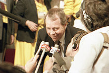 Colour photograph of former Federal Minister for Indian Affairs and Northern Development, the Honourable David Crombie speaking to reporters on the floor of the 1983 Progressive Conservative leadership convention