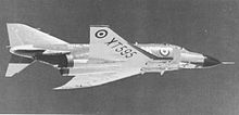 Starboard black-and-white view of jet aircraft in-flight.