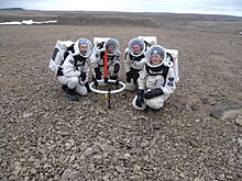 Crew members Brian Shiro, Christy Garvin, Stacy Cusack and Kristine Ferrone deploy the TEM47-PROTEM low frequency electromagnetic survey equipment on Haynes Ridge during EVA 8.