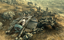 A small alien spacecraft is crashed in the wastelands.