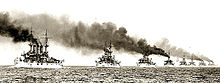 Photograph of the U.S. fleet of battleships sailing in line during the world tour known as the Great White Fleet