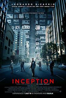 A man in a suit with a gun in his right hand is flanked by five other individuals in the middle of a street which, behind them, is folded upwards. Leonardo DiCaprio's name and those of other cast members are shown above the words "Your Mind Is The Scene Of The Crime". The title of the film "INCEPTION", film credits, and theatrical and IMAX release dates are shown at the bottom.