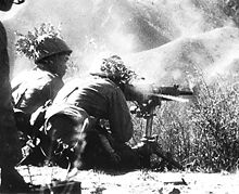 Japanese troops firing a heavy machine gun.jpg