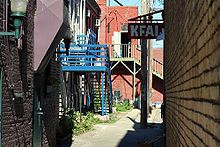 KFAI and the back entrance to old buildings with brightly colored woodwork