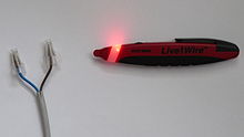The tip of this non-contact pen-shaped tester lights up near live wires