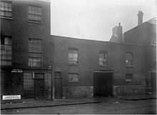 Victorian photograph of the exterior of a London slum property