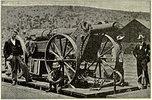 Boer Long Tom gun packed for travel on board a train with the barrel removed from the carriage.