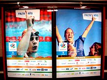 Two posters showing athletes, a swimmer and a soccer player, celebrating.