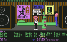 A horizontal rectangular video game screenshot that is a digital representation of domestic room. Two human characters stand beside a green tentacle in the middle of the room. Below the scene is a list of commands.
