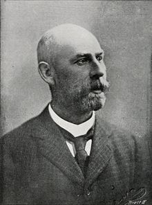 b&w portrait of a bearded, bald man