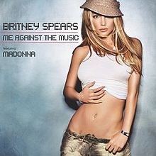 A blond wearing a white stop standing in front of a cement wall. The words "Britney Spears Me Against the Music featuring Madonna" are written in capital black letters.