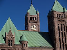 Four of city hall's turrets seen near the roof
