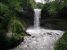 Minnehaha Falls surrounded by dark green summer foilage