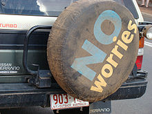 A tire cover on the back of an SUI displays the slogan.