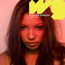 A portrait shaded in sepia featuring the front facial profile of an African-American woman. The top right of the portrait features the initials 'w g' in stylised yellow font. Below the 'w' in standard, reduced, white, capital letter font is the name 'Wynter Gordon' and in further reduced font below the name is the title 'Dirty Talk'.