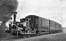 Small locomotive hauls four coaches of various designs