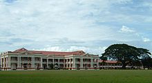 Part of the Malay College Kuala Kangsar buildings with its football field in the foreground.