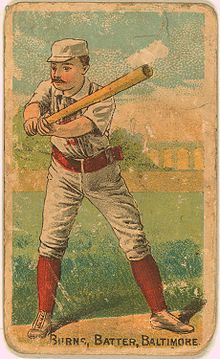 A baseball card of Oyster Burns batting in a white uniform with a red belt and socks