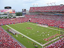 A photograph of a sports stadium viewed diagonally across the field.