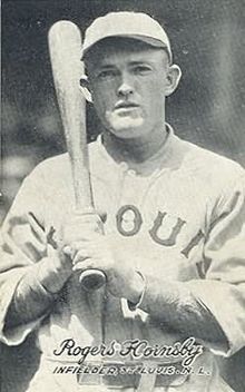 Rogers Hornsby in a St. Louis Browns uniform, a bat held over his right shoulder