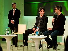 Eric Schmidt, Sergey Brin, and Larry Page sitting together