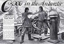  Advertisement showing two men in heavy clothing on the deck of a ship, with icy mountains in the background. The men are pouring drinks from a jug, The slogan reads "Oxo in the Antarctic"
