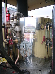 Inside the cab of 'The Elephant' steam tractor, showing the boiler casing and controls