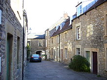 Narrow street between stone houses