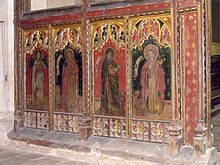The lower part of a brightly painted screen showing four figures